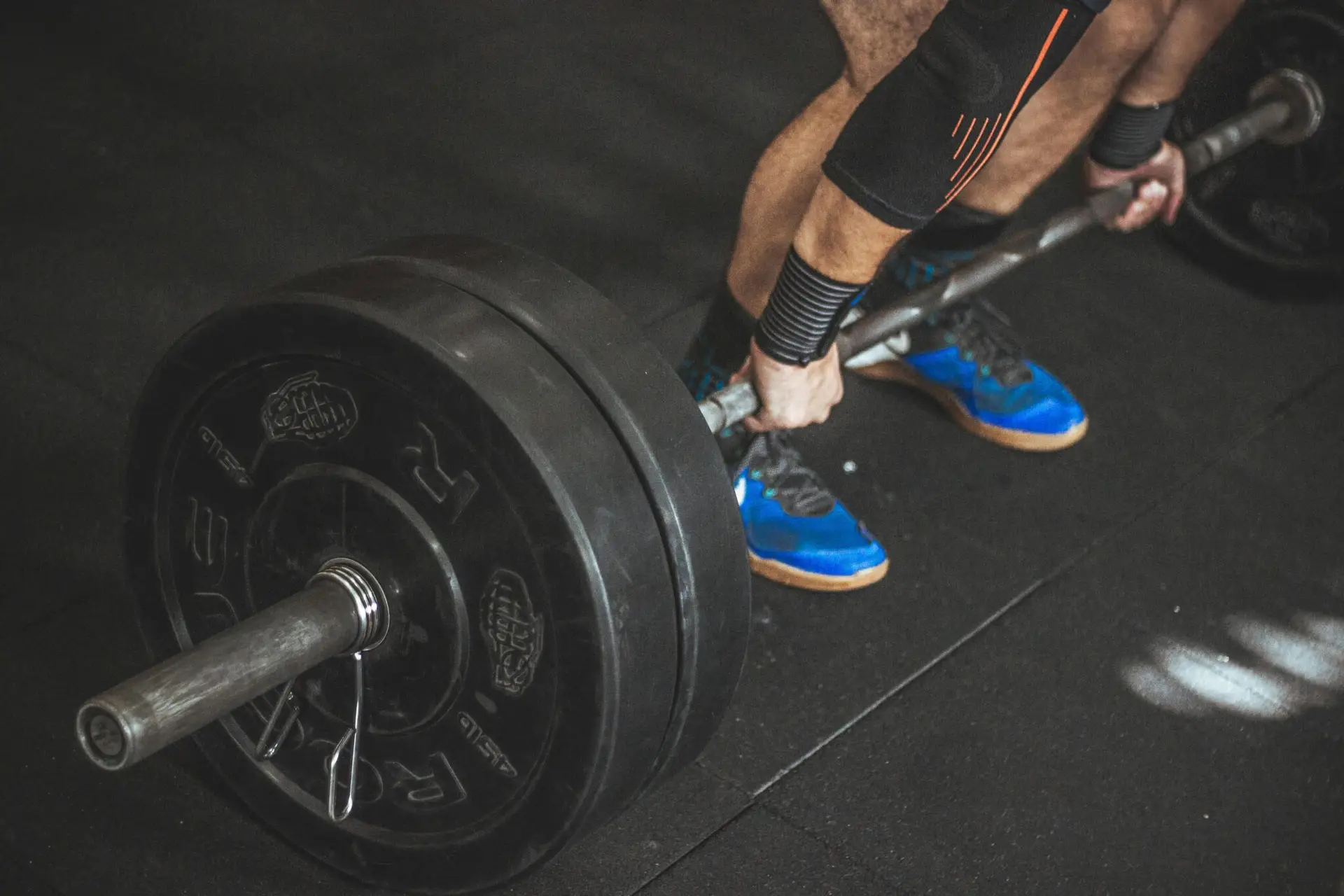 Person weightlifting at the gym.