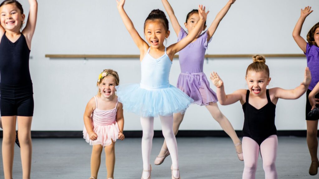 A couple of young people participating in a dance class