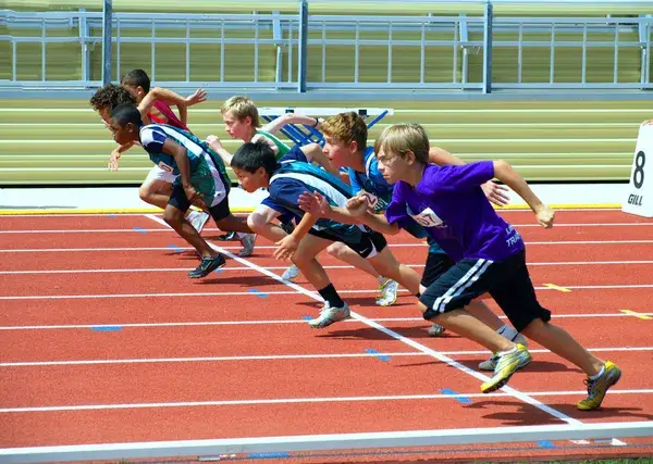 The start of a track and field race run by youth