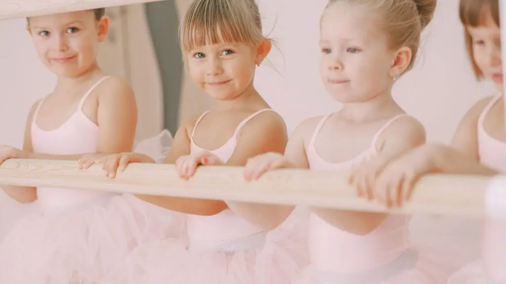 Several girls doing ballet in a dance class